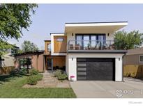 Stunning two-story home with a balcony, modern garage door, and beautifully landscaped front yard at 3560 16Th St, Boulder, CO 80304