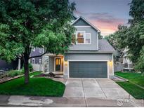 Charming two-story home featuring a well-maintained lawn and a spacious two car garage at 109 Gold Hill Dr, Lafayette, CO 80026
