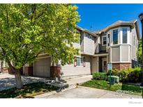 Charming townhome featuring a two-car garage and landscaped front yard at 13024 Grant W Cir # A, Thornton, CO 80241