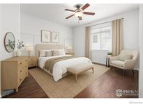 Bright bedroom featuring a ceiling fan, neutral-toned walls, and a comfortable bed with decorative pillows at 13024 Grant W Cir # A, Thornton, CO 80241