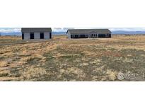 Wide angle shot of a manufactured home on a large rural homesite at 17913 County Road 38, Platteville, CO 80651