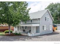 Charming two-story home with a covered porch and a well-maintained yard in a desirable neighborhood at 2565 Pierce St, Lakewood, CO 80214