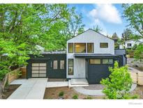 Modern two-story home showcasing a stylish gray and black exterior with well-manicured landscaping at 2860 Table Mesa Dr, Boulder, CO 80305