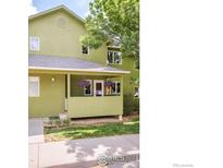 Charming home featuring a covered porch with hanging flower baskets and a well-maintained lawn at 4620 15Th St # C, Boulder, CO 80304