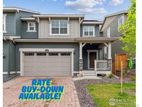Charming two-story home with a spacious two-car garage and inviting front porch at 645 Flintwood Pl, Lafayette, CO 80026