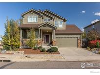 Charming two-story home with well-maintained landscaping and a two-car garage at 13420 Spruce St, Thornton, CO 80602
