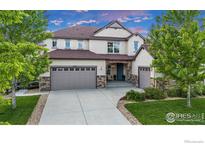 Charming two-story home with a three-car garage and stone accents at 2264 Front Range Rd, Erie, CO 80516