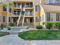 Inviting condo exterior with multiple units, balconies, well-manicured landscaping, and visible unit numbers at 4749 White Rock Cir # D, Boulder, CO 80301