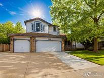 Charming two-story home with three-car garage and well-maintained lawn in a suburban neighborhood at 2720 E 121St Pl, Thornton, CO 80241