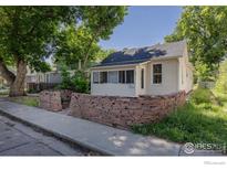 Charming single-story home with a landscaped front yard and a quaint, inviting facade at 29 Marshall Pl, Longmont, CO 80504