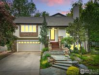 Charming home featuring a stone stairway, a two car garage and beautiful landscaping at 3835 Norwood Ct, Boulder, CO 80304