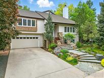 Charming home featuring a stone stairway, a two car garage and beautiful landscaping at 3835 Norwood Ct, Boulder, CO 80304