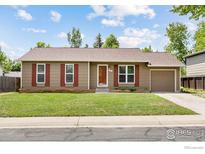 Charming single-story home with a well-maintained lawn and a one-car garage in a suburban setting at 852 W Linden St, Louisville, CO 80027