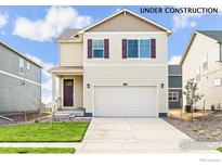 Charming two-story home featuring a 2-car garage, neutral siding, and complementary maroon-colored shutters at 1638 Plata St, Lochbuie, CO 80603