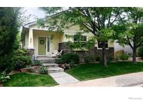 Charming single-Gathering home with a welcoming front porch and well-maintained landscaping in a peaceful neighborhood at 1847 White Feather Dr, Longmont, CO 80504