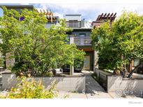 Charming two-story home with lush landscaping and a cozy front porch seating area at 5060 Pierre St # B, Boulder, CO 80304