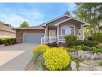 Charming one-story home featuring a well-kept lawn, and a two car garage at 742 Megan Ct, Longmont, CO 80504