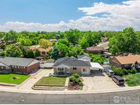 Charming home with a well-maintained yard, mature trees, and convenient carport in a desirable neighborhood at 10951 Rosalie Dr, Northglenn, CO 80233