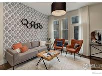 Inviting living room featuring a modern patterned wall, gray sofa, and sleek, contemporary furnishings at 2139 N Downing St, Denver, CO 80205