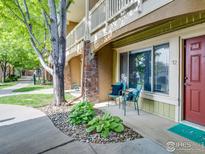 Charming front porch with seating area, stone accents, and well-maintained landscaping at 4800 Osage Dr # 12B, Boulder, CO 80303