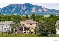 Stunning home with an outdoor deck that provides breathtaking views of the surrounding lush landscape and majestic mountains at 5695 Aurora Pl, Boulder, CO 80303