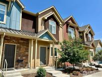Charming townhome with multiple tones and well-maintained landscaping at 1240 Wren Ct # D, Longmont, CO 80501