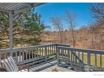Relaxing balcony featuring scenic views and comfortable seating area at 1449 Adams Pl, Louisville, CO 80027