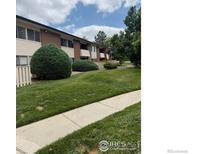 Charming two-story building with well-maintained lawn and mature trees at 5102 Williams Fork Trl # 205, Boulder, CO 80301