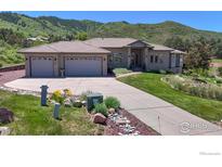 Beautiful home exterior with a three car garage and lush landscaping at 10950 Elk Horn Run, Littleton, CO 80125