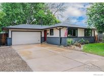 Charming single-story home with a two-car garage and inviting curb appeal at 1600 Harvard St, Longmont, CO 80503