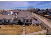 Charming single-Gathering home featuring a landscaped front yard and a cozy, inviting entrance at 20764 E 47Th Ave, Denver, CO 80249