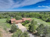 Spacious home with mature trees and landscaping in a rural setting at 8586 N 55Th St, Boulder, CO 80301