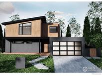 Modern, two-story home featuring a sleek design with wood siding, a spacious garage, and landscaped front yard at 1265 Hartford Dr, Boulder, CO 80305