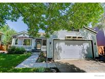 Charming single-Gathering home featuring a well-maintained lawn, front porch, and attached two-car garage at 1673 Bain Dr, Erie, CO 80516