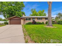 Charming brick ranch-style home with an attached garage and a well-maintained front yard at 40 Cornell Dr, Longmont, CO 80503