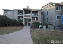Condominium exterior with well-maintained landscaping and a walkway leading to the entrance at 20 S Boulder Cir # 2204, Boulder, CO 80303