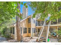Charming multi-level townhouse with mature landscaping and outdoor staircase at 4771 White Rock Cir # B, Boulder, CO 80301
