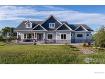 Charming two-story home featuring a beautifully landscaped yard and stone accents at 505 Nesting Eagles Way, Berthoud, CO 80513