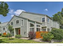 Charming exterior of townhome featuring clean lines, new siding and a well-maintained lawn at 5150 Buckingham Rd, Boulder, CO 80301