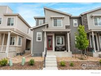 Charming two-story home with a cozy front porch and modern architectural details at 5341 Warrior St, Frederick, CO 80504