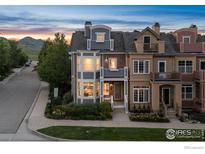 Charming multi-story townhouse with beautiful architectural details and a well-maintained front yard at 555 Laramie Blvd, Boulder, CO 80304