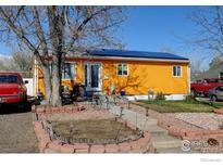 Charming home with a well-maintained yard and solar panels on the roof at 7970 Wolff Ct, Westminster, CO 80030
