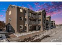 Inviting condominium building with private balconies and snow-lined sidewalks at 1175 S Gilbert St, Castle Rock, CO 80104