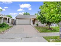 Charming single-story home with a well-maintained lawn and inviting curb appeal at 858 Turpin Way, Erie, CO 80516