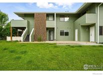 Inviting townhouse with manicured lawn and multiple entryways at 1900 Chalcis Dr # 42, Lafayette, CO 80026