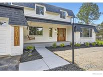 Charming home featuring a swing, fresh landscaping and a walkway leading to a double-door wood entry at 2101 Champlain Dr, Boulder, CO 80301
