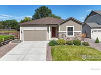 Charming single-Gathering home with a well-maintained lawn and a two-car garage at 982 Blue Bell Rd, Berthoud, CO 80513