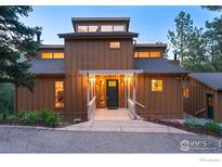 Charming home with a pergola entryway, well-lit and beautifully landscaped at 207 Kelly E Rd, Boulder, CO 80302