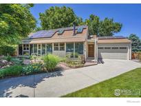 Charming ranch home with a well-maintained front yard, solar panels, and an attached two-car garage at 623 Mead Ct, Louisville, CO 80027