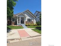 Charming single-Gathering home with a well-manicured lawn and covered front porch at 1518 Hollyberry St, Berthoud, CO 80513